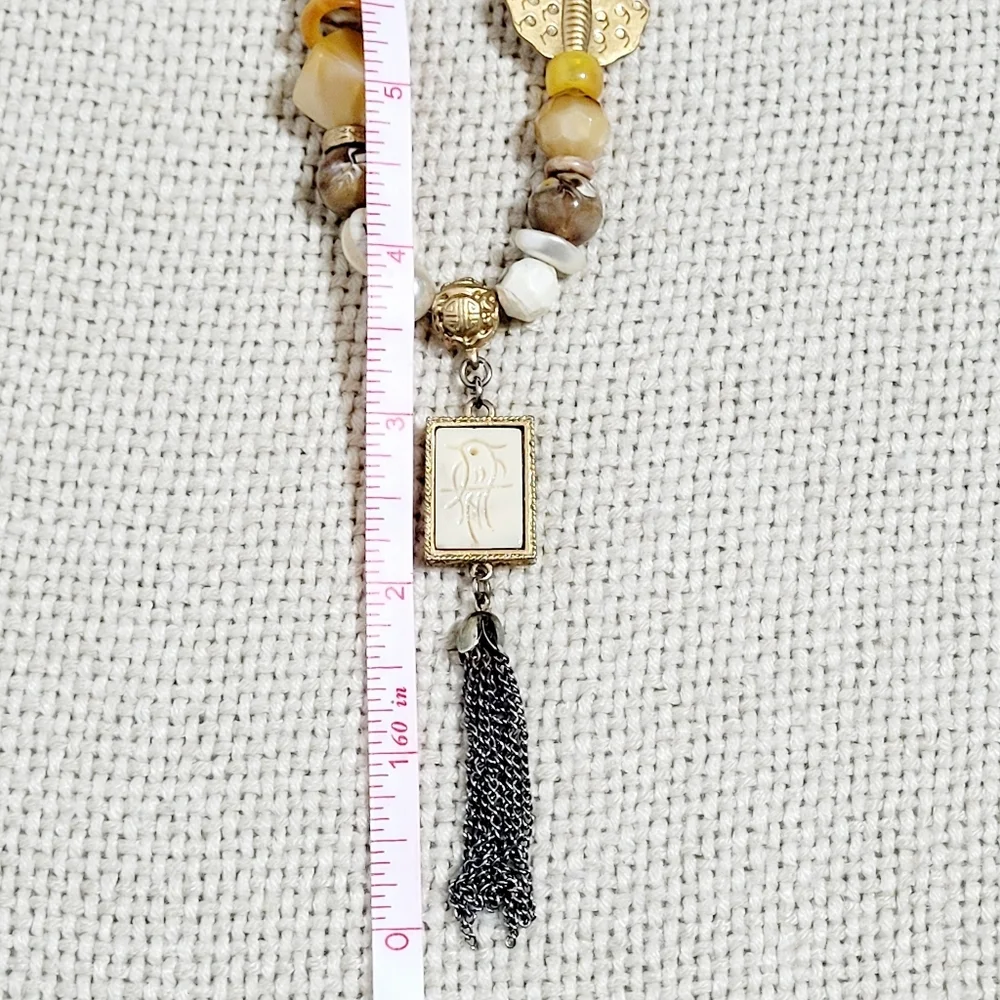 Silver and Gold Tone Necklace with a Bird, Butterfly and Beads.
